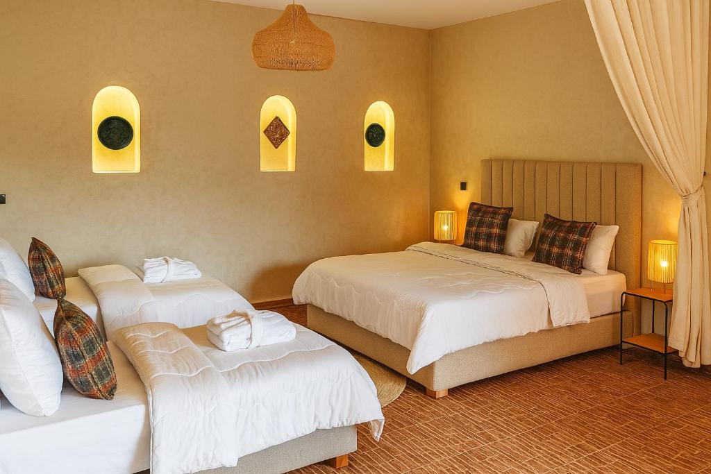 Chambre familiale avec lits jumeaux et niches en arc, Bougainvilla Retreat